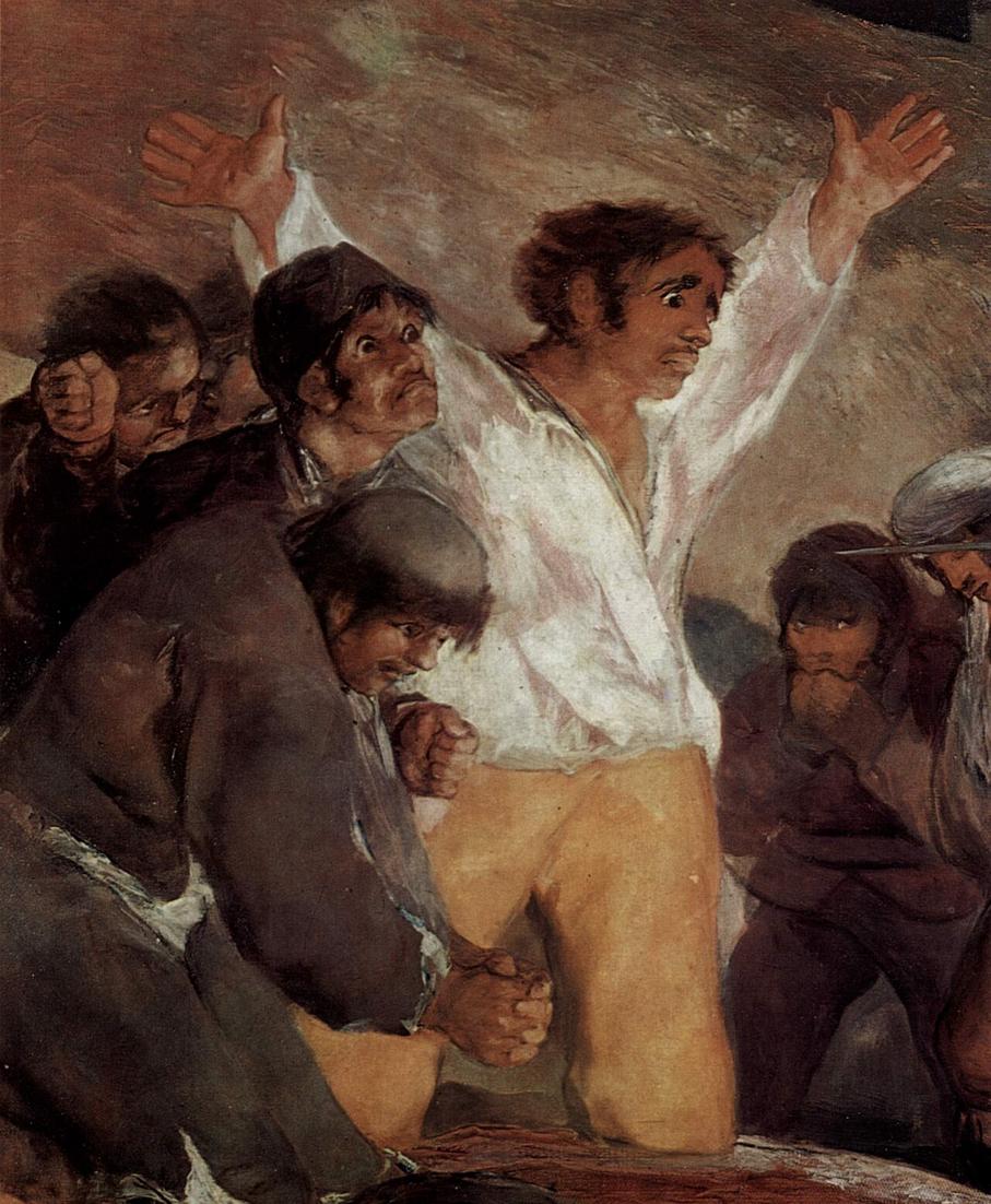 Detail of the central man in a white shirt, his arms raised in front of the soldiers’ rifles